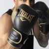 Guantes De Boxeo Everlast Powerlock Negro/oro 1 Guantes De Boxeo Everlast Powerlock Negro/oro -tienda de material de boxeo guantes de boxeo everlast powerlock negrooro